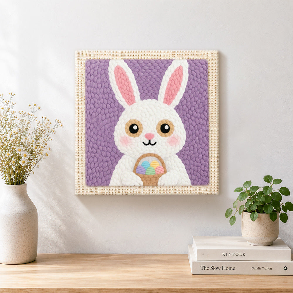 Finished easter bunny with egg basket artwork displayed on a wall