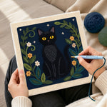 Creating handmade elegant black cat and botanical punch needle artwork
