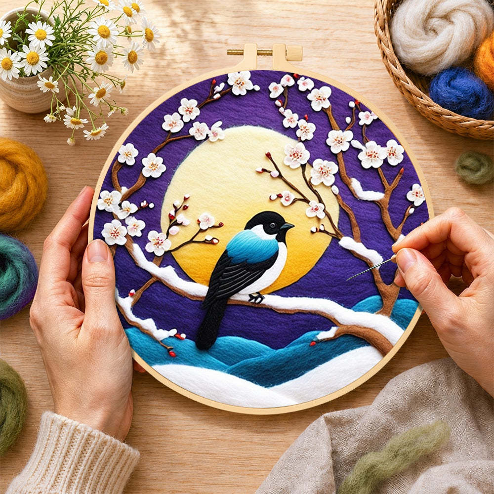 Creating the elegant blue bird on snowy plum branch wool painting by hand with a felting needle