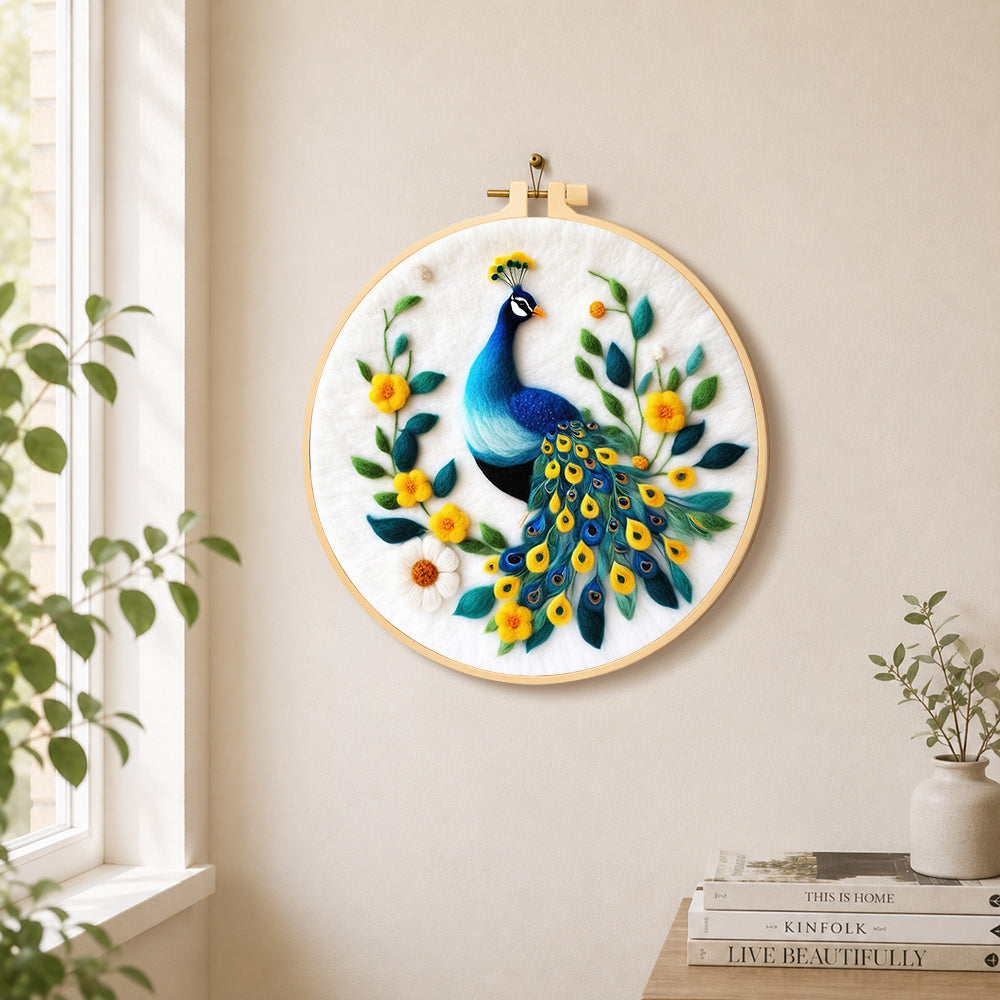 Elegant blue peacock needle felt wall art displayed in a bright home interior
