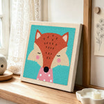 Elegant fox with pink polka dot collar punch needle artwork displayed on a table