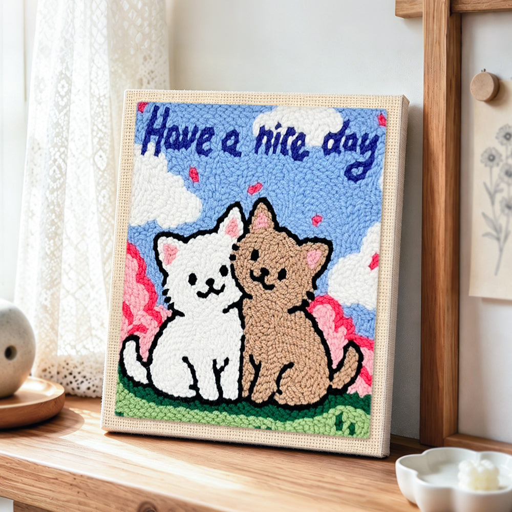 Elegant "Have a Nice Day" cat couple punch needle artwork displayed on a table