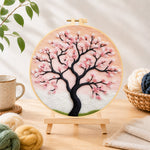 Finished elegant pink cherry blossom tree needle felting displayed on a wooden easel