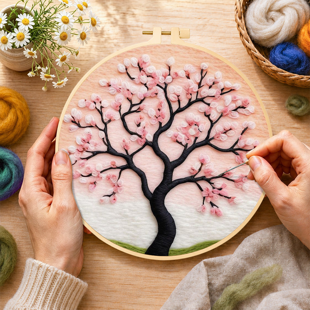 Creating the elegant pink cherry blossom tree wool painting by hand with a felting needle