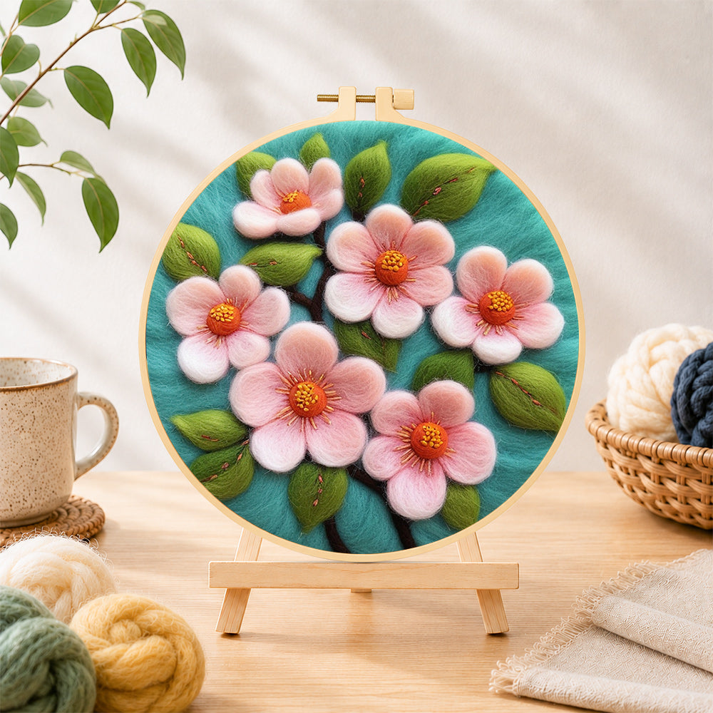Finished elegant pink flowers needle felting displayed on a wooden easel