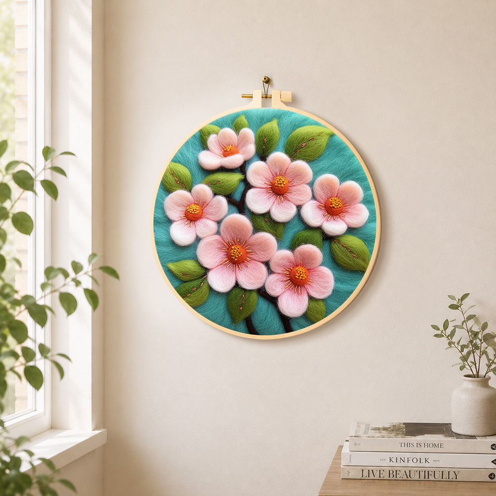 Elegant pink flowers needle felt wall art displayed in a bright home interior
