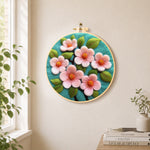 Elegant pink flowers needle felt wall art displayed in a bright home interior