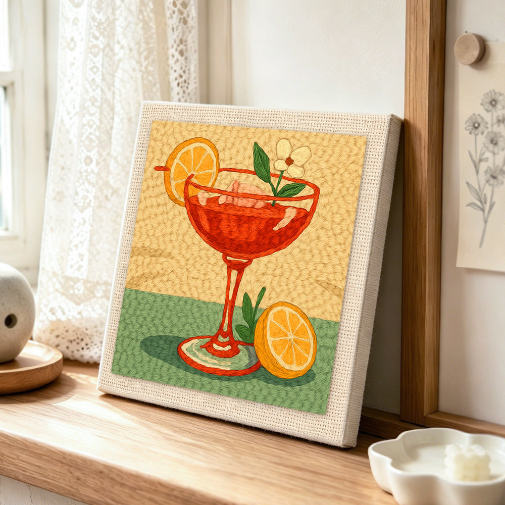 Elegant red cocktail punch needle artwork displayed on a table