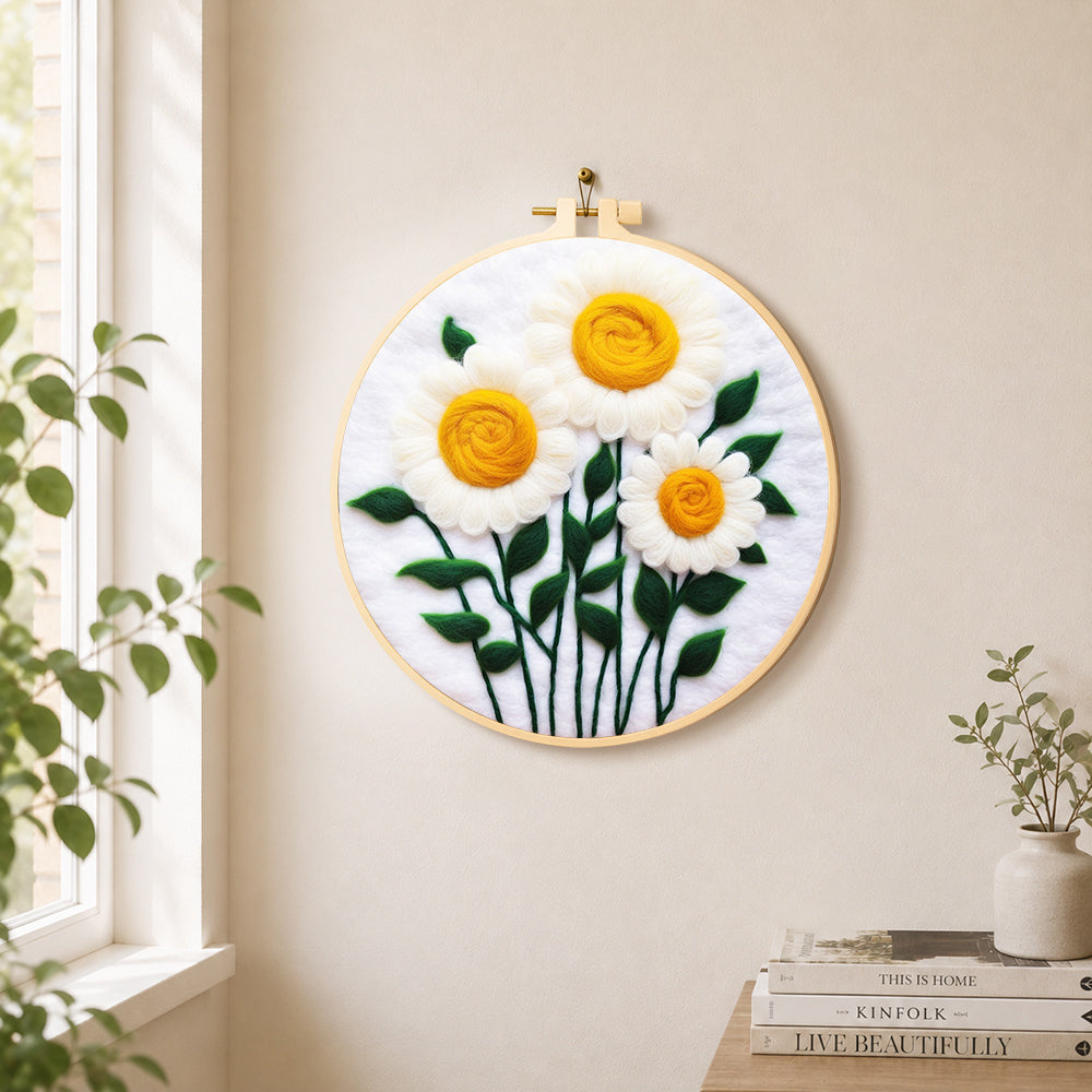 Elegant white daisies with yellow stamens needle felt wall art displayed in a bright home interior