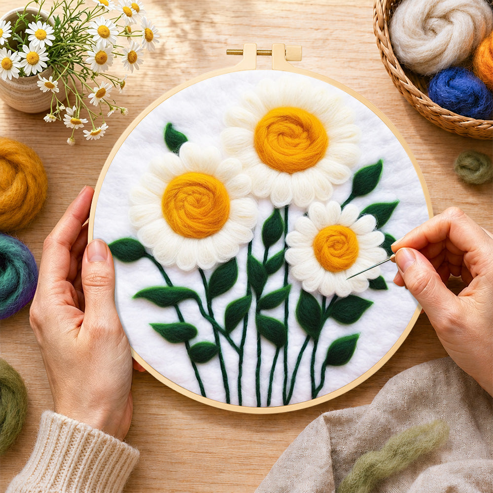 Creating the elegant white daisies with yellow stamens wool painting by hand with a felting needle