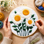 Creating the elegant white daisies with yellow stamens wool painting by hand with a felting needle
