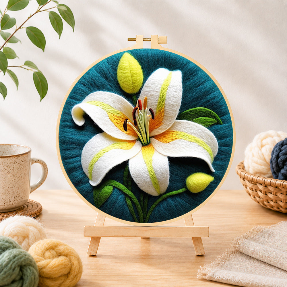 Finished elegant white lily needle felting displayed on a wooden easel