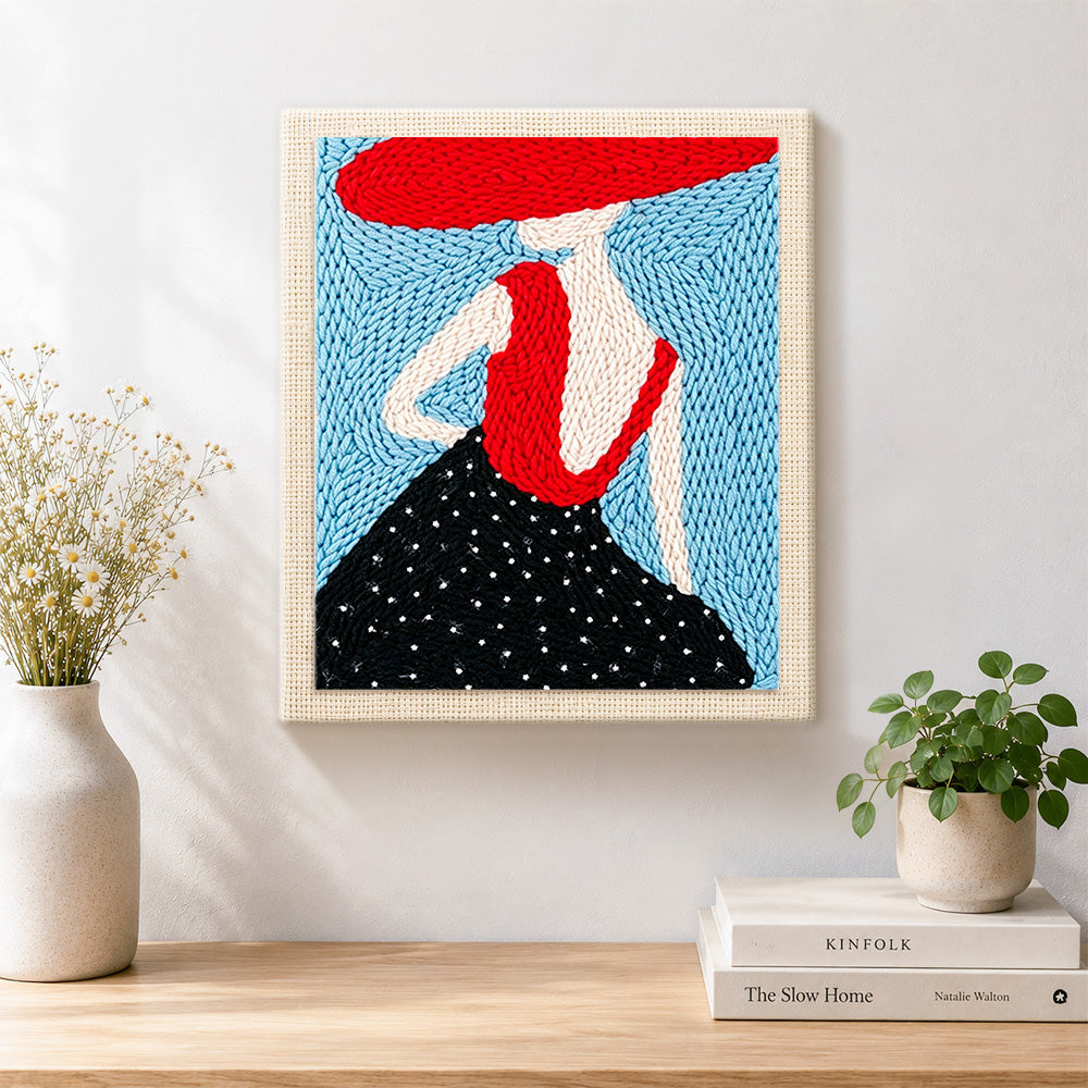 Finished elegant woman in red hat artwork displayed on a wall