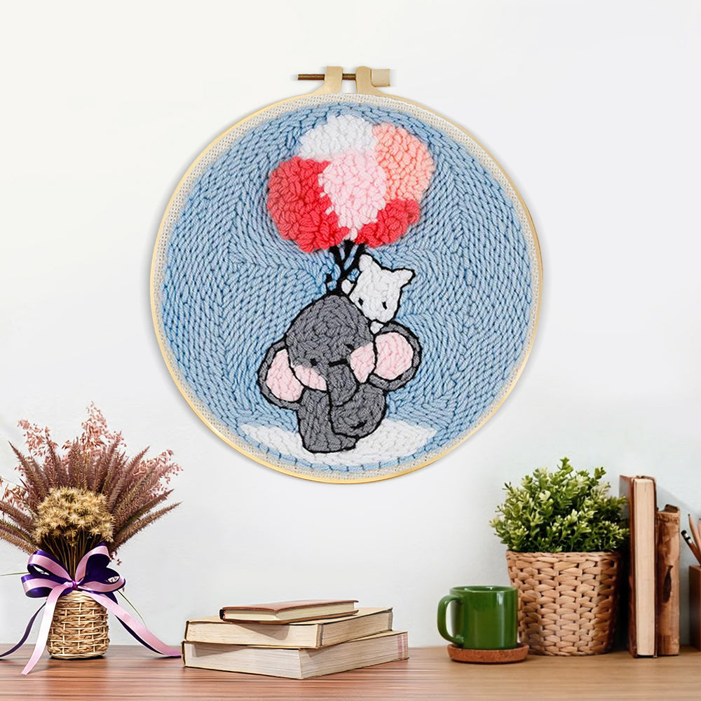Finished elephant with balloons artwork displayed on a wall