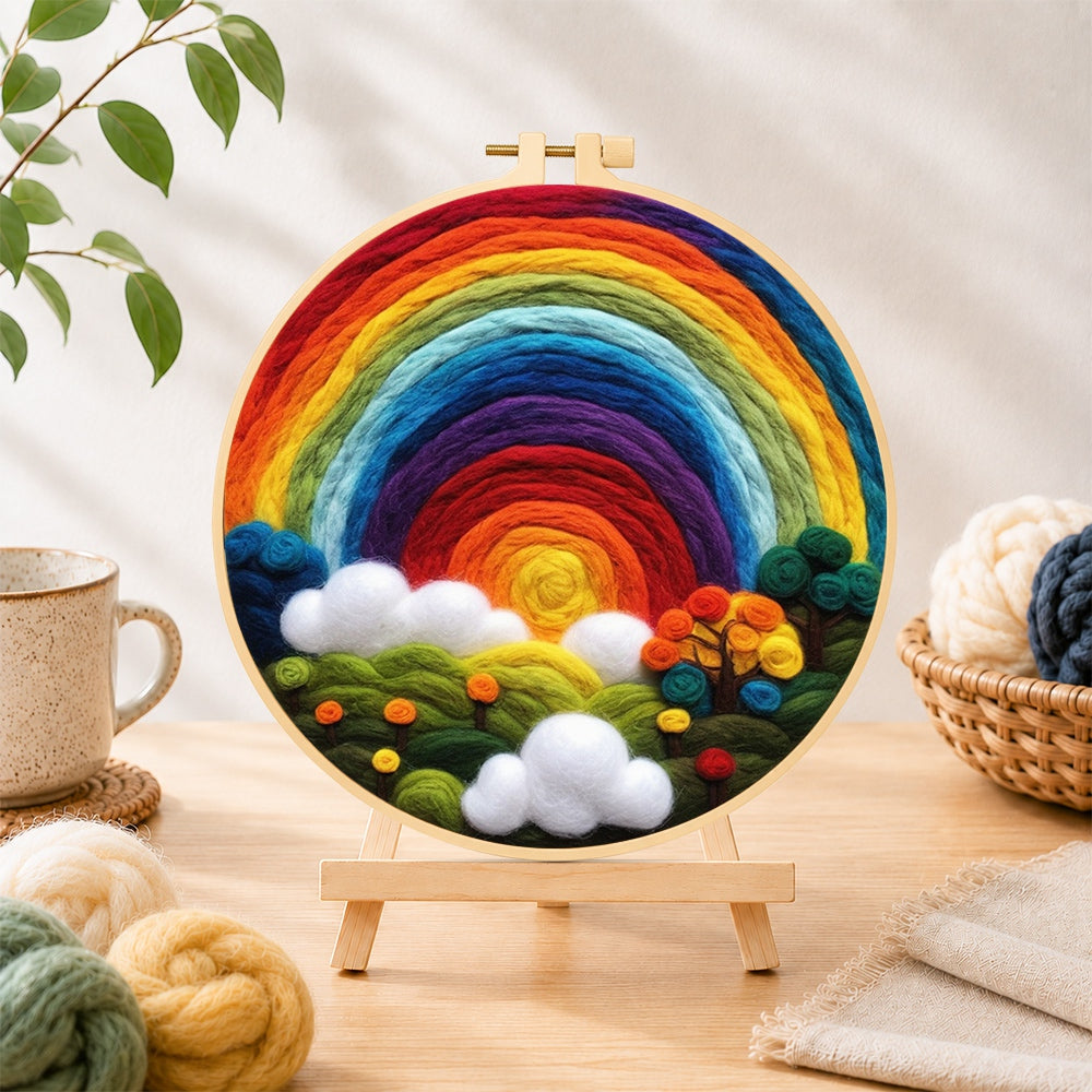 Finished enchanted forest rainbow needle felting displayed on a wooden easel
