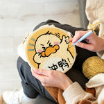 Creating handmade encouraging cartoon duck punch needle artwork