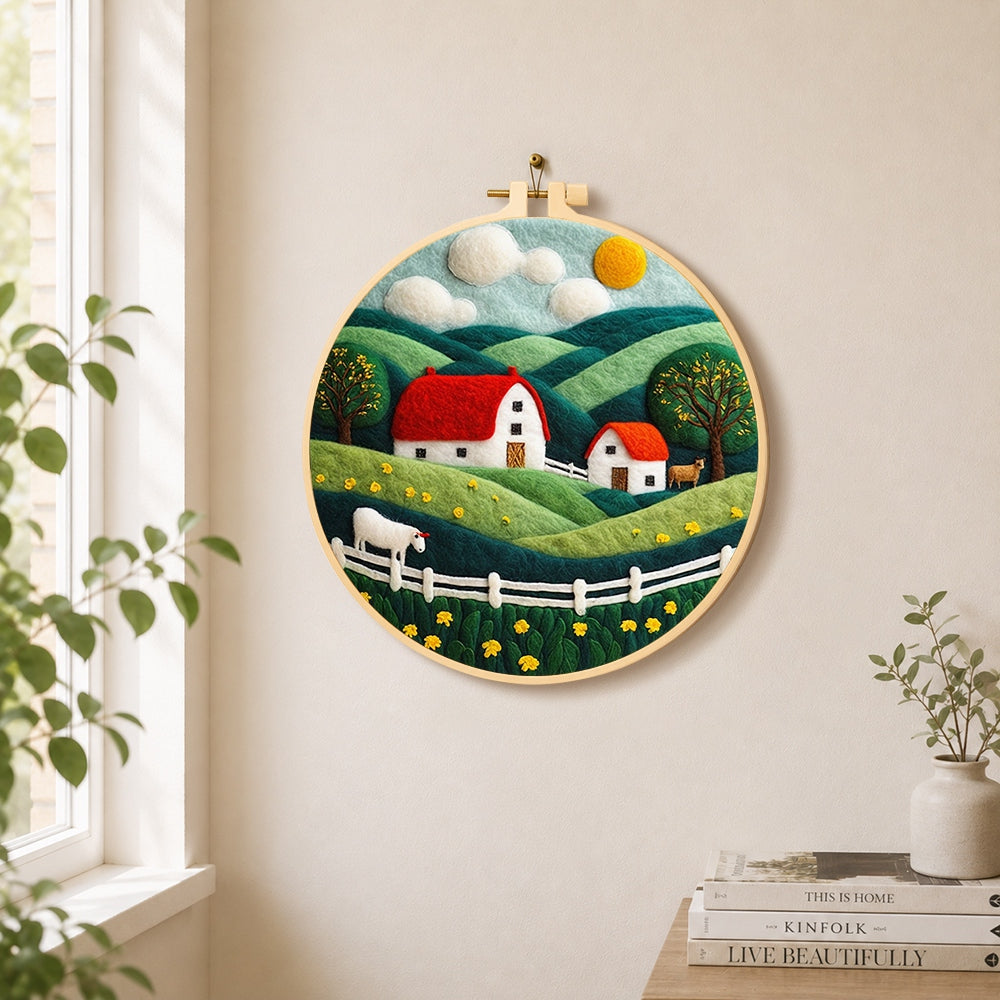 English cottage and rolling hills needle felt wall art displayed in a bright home interior
