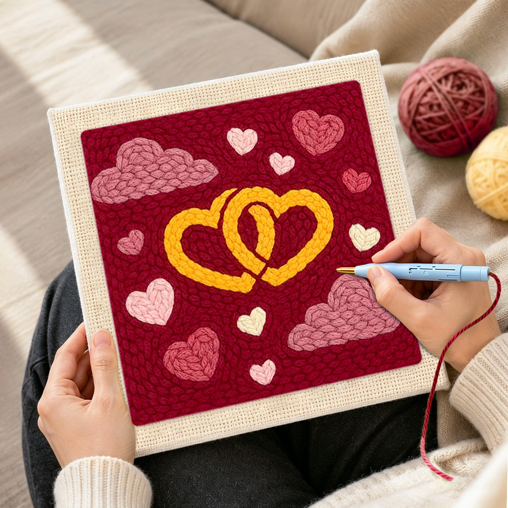 Creating handmade entwined yellow hearts punch needle artwork