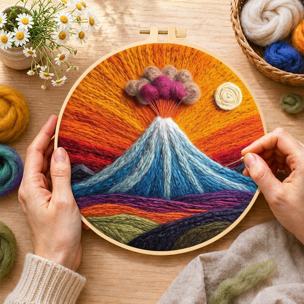 Creating the erupting volcano with smoke clouds wool painting by hand with a felting needle