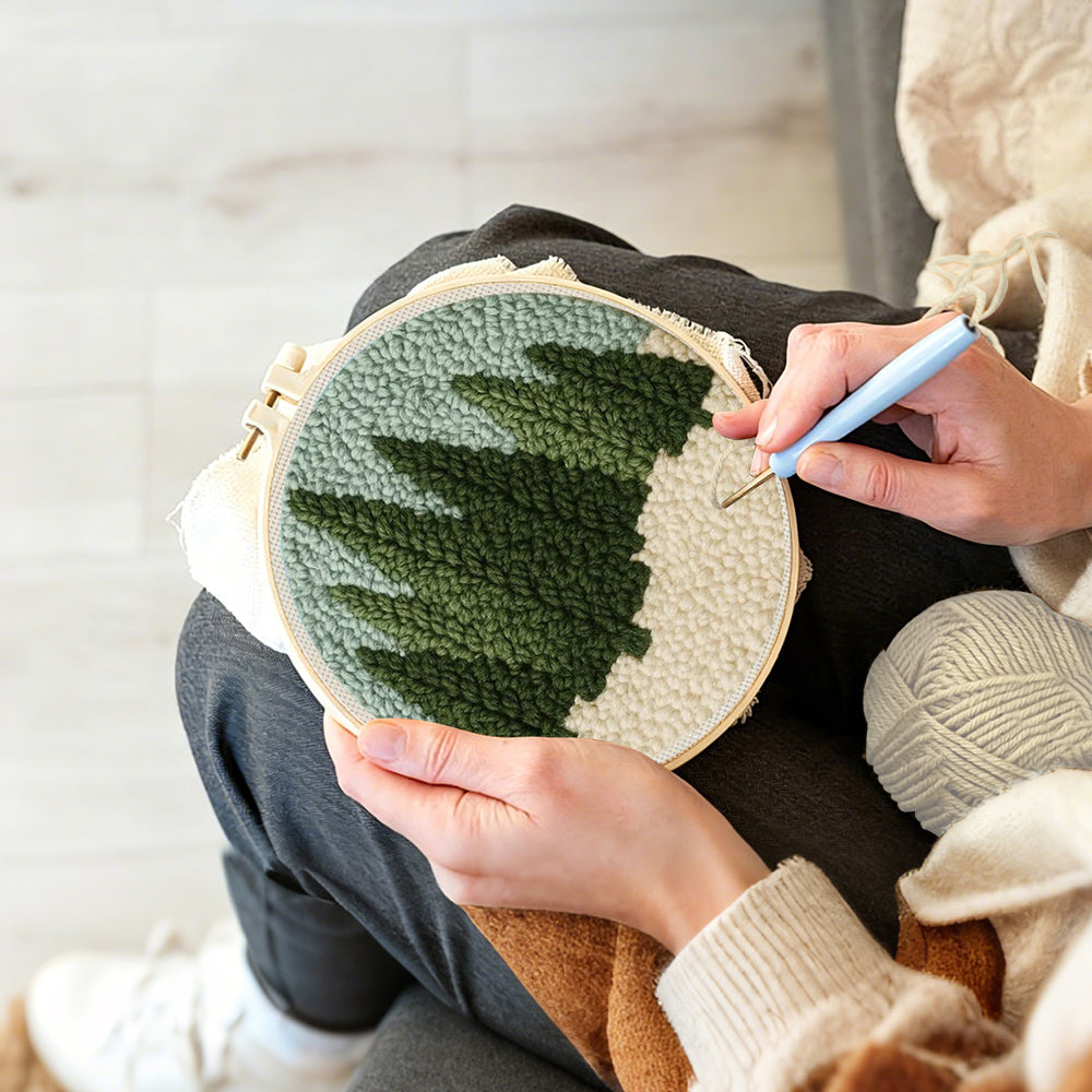 Creating handmade evergreen forest punch needle artwork