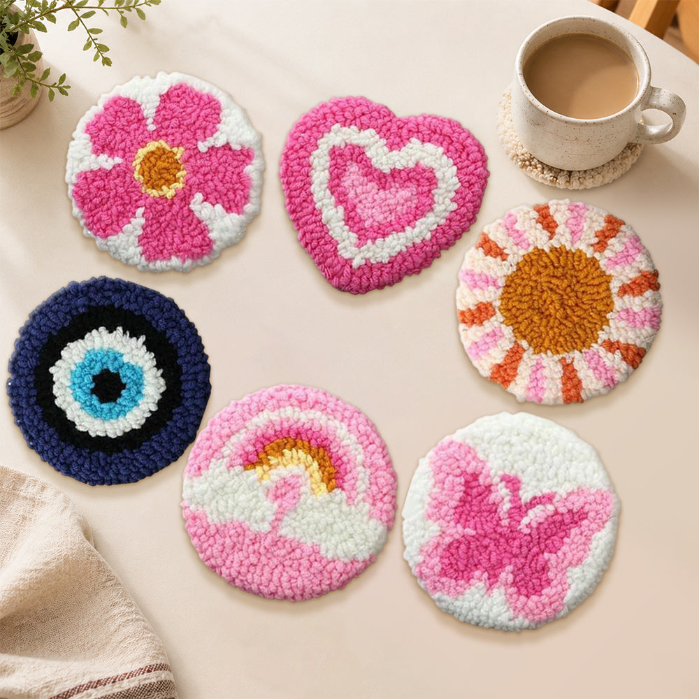 Evil eye, rainbow and butterfly punch needle coasters used for home decoration