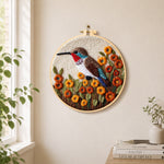 Exquisite hummingbird with autumn flowers needle felt wall art displayed in a bright home interior