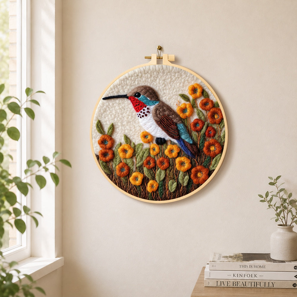 Exquisite hummingbird with autumn flowers needle felt wall art displayed in a bright home interior
