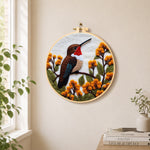 Exquisite ruby-throated hummingbird and autumn flowers needle felt wall art displayed in a bright home interior