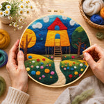 Creating the fairy tale tall red roof cottage wool painting by hand with a felting needle