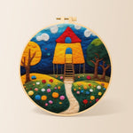 Fairy tale tall red roof cottage needle felting kit for beginners with a round wooden frame