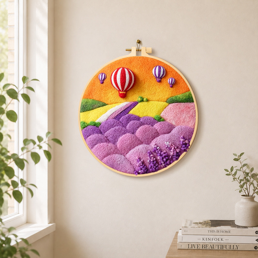 Fantasy hot air balloon tour and pastel hills needle felt wall art displayed in a bright home interior