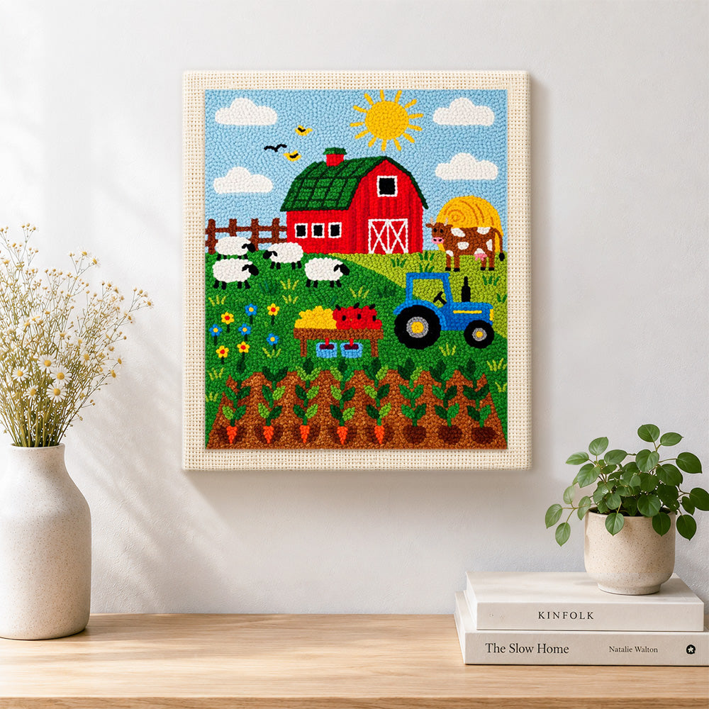 Finished farmyard animals and carrot field artwork displayed on a wall