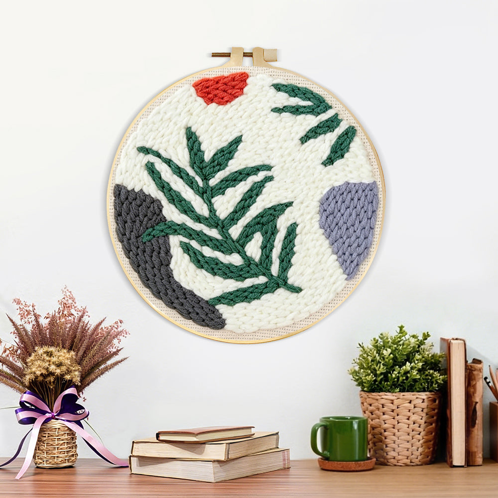 Finished fern leaf artwork displayed on a wall