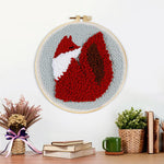 Finished fiery red fox artwork displayed on a wall