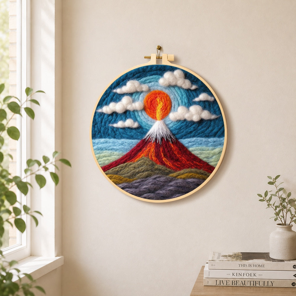 Fiery red volcano under the swirling sky needle felt wall art displayed in a bright home interior