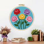 Finished five vibrant roses artwork displayed on a wall