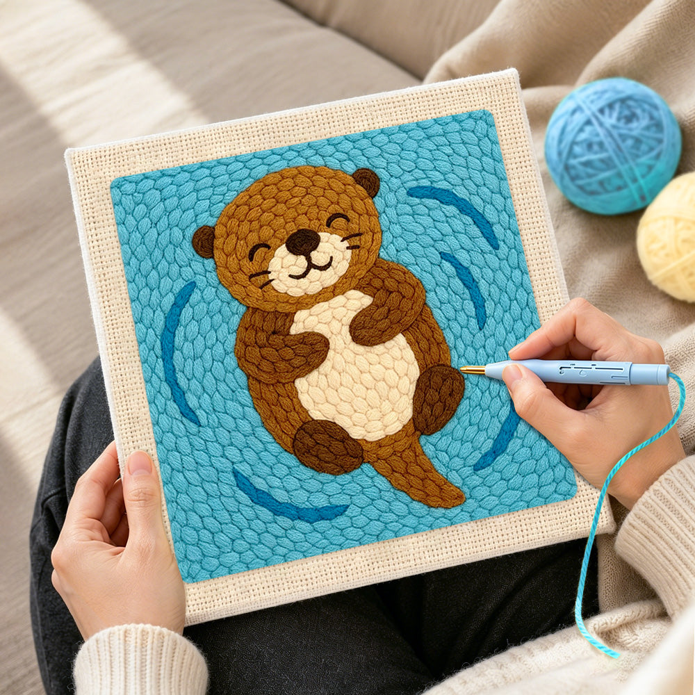 Creating handmade floating happy otter punch needle artwork