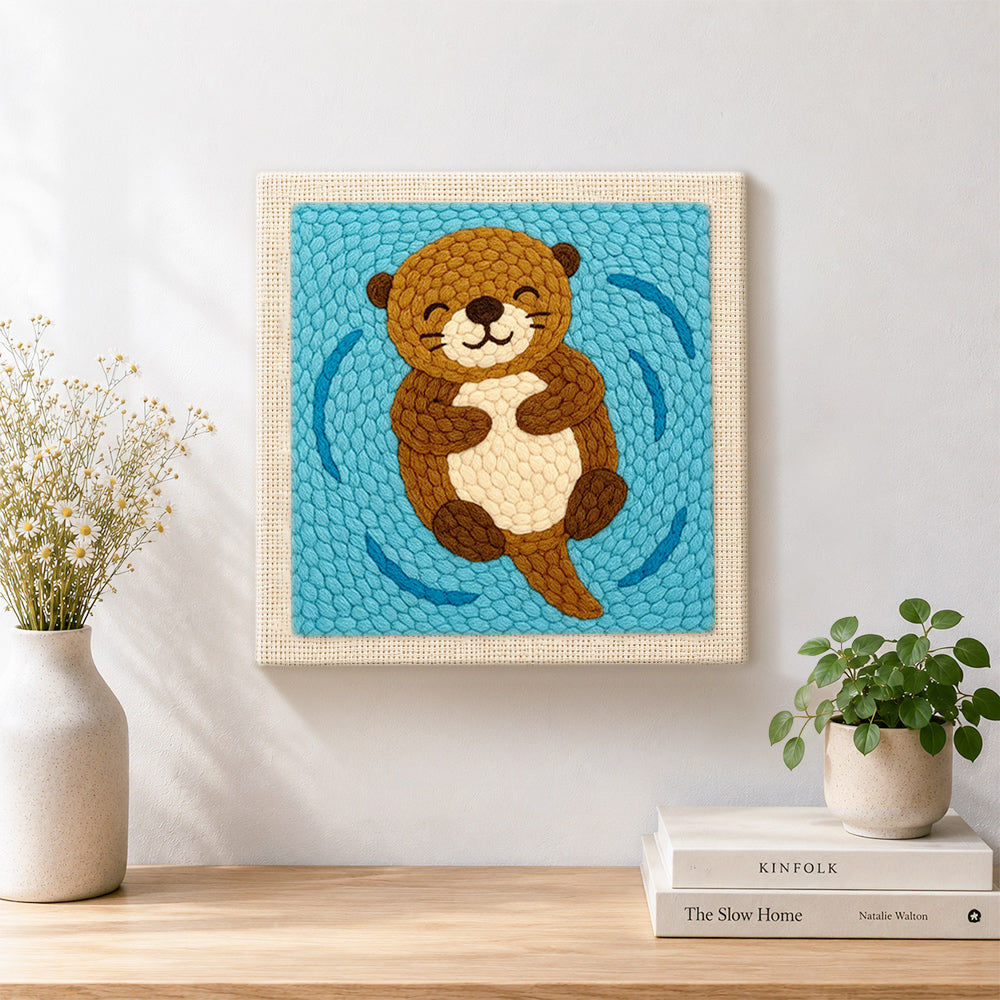Finished floating happy otter artwork displayed on a wall