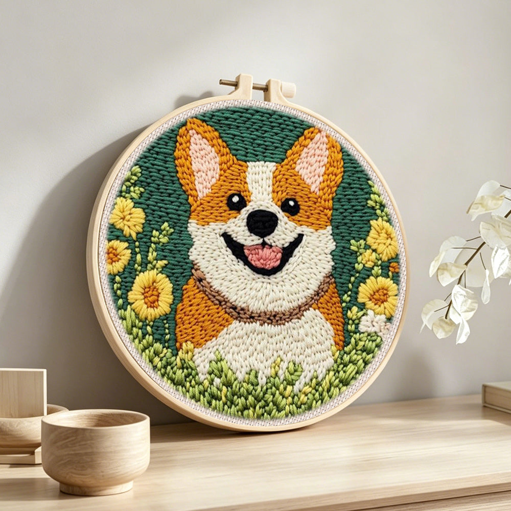 Floral corgi punch needle artwork displayed on a table