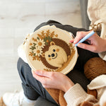 Creating handmade floral crown hedgehog punch needle artwork
