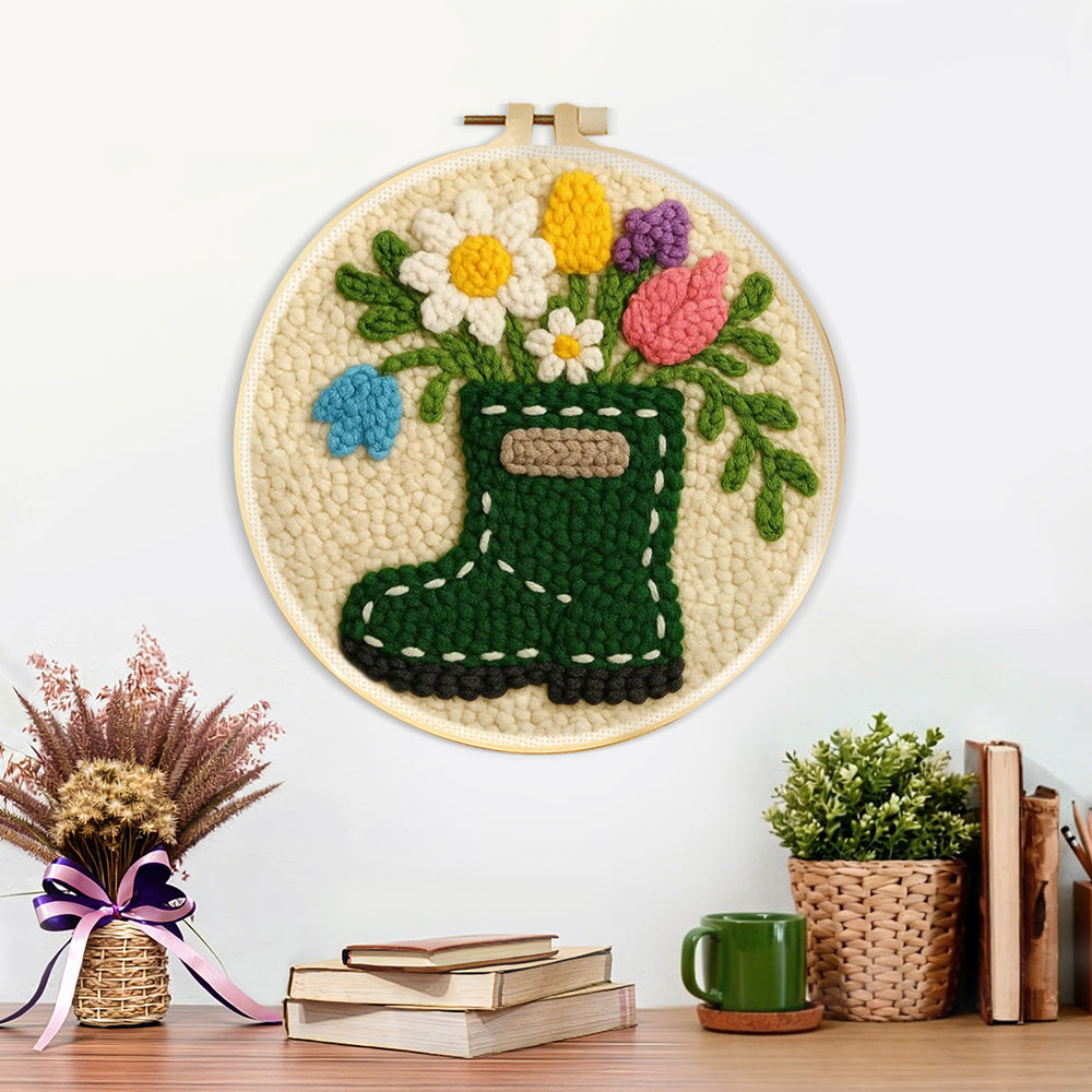 Finished floral green wellies boot vase artwork displayed on a wall