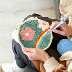 Creating handmade floral meadow with rainbow punch needle artwork
