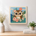 Finished floral owl with pink moon artwork displayed on a wall