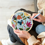 Creating handmade flower vines and little bluebird punch needle artwork