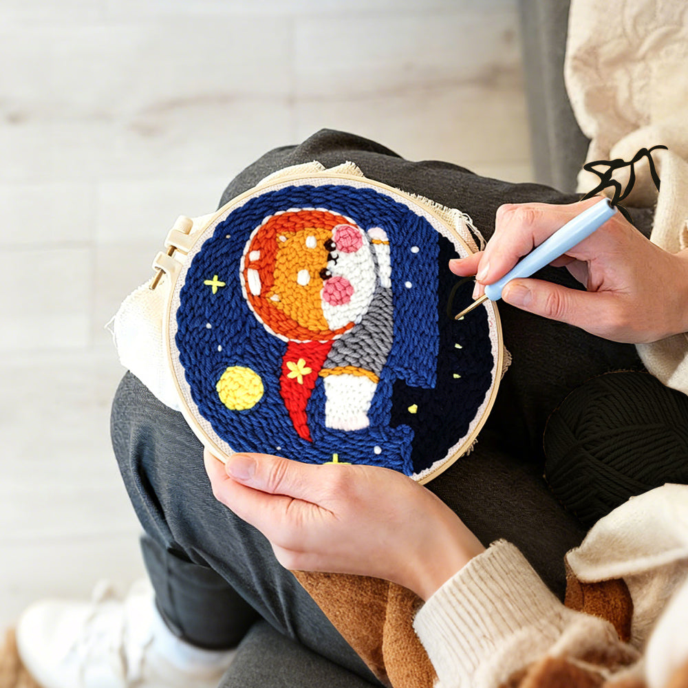 Creating handmade flying space puppy punch needle artwork