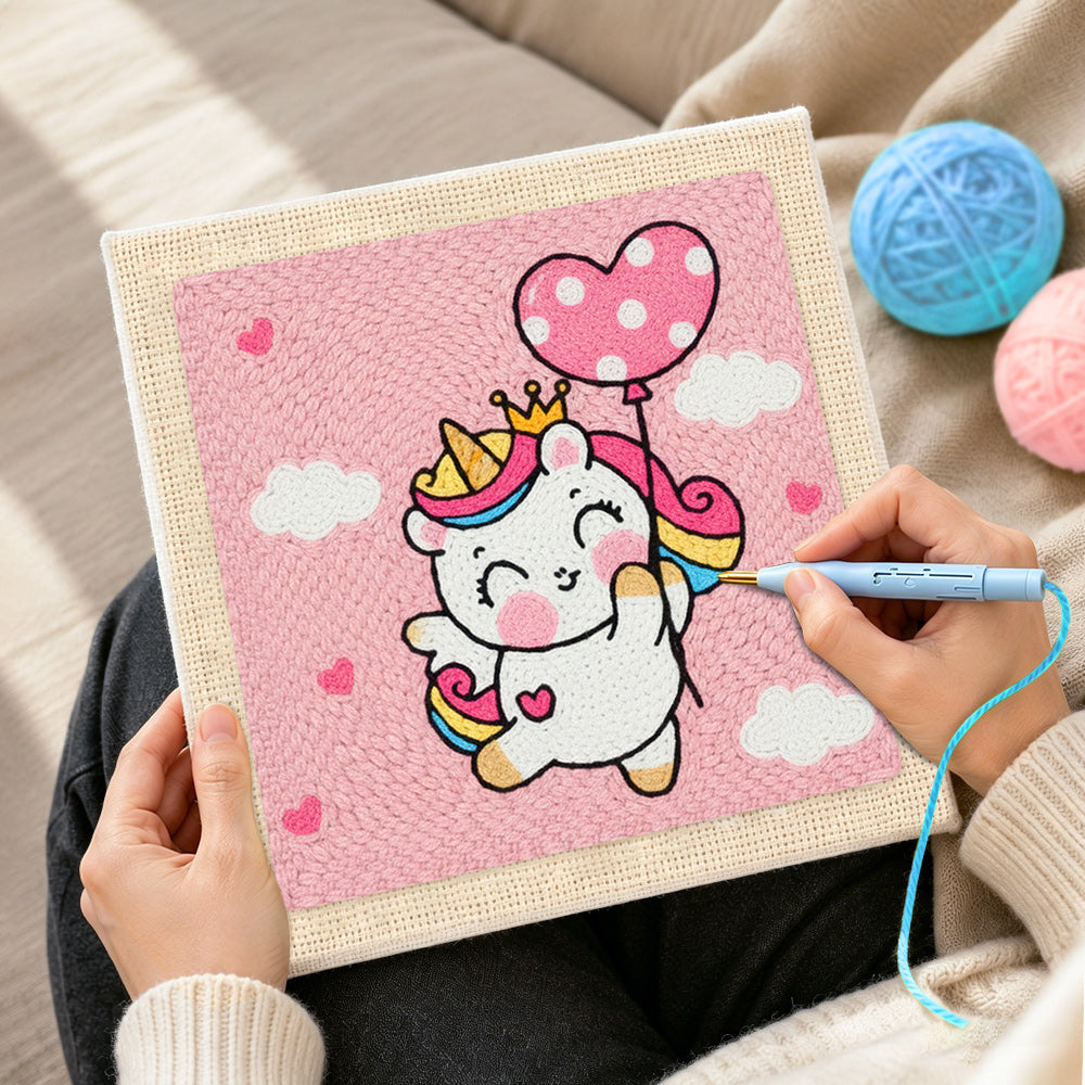 Creating handmade flying unicorn with heart balloon punch needle artwork