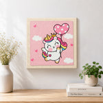 Finished flying unicorn with heart balloon artwork displayed on a wall