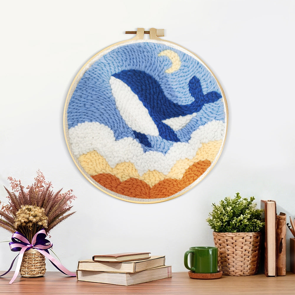 Finished flying whale in the sky with clouds artwork displayed on a wall