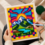 Creating handmade folk art style mountains and sun rays punch needle artwork