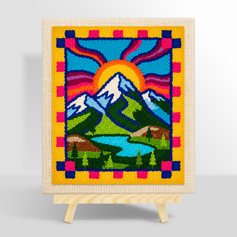 Folk art style mountains and sun rays punch needle kit for beginners